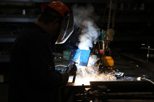 Welder at Track Machines Facility